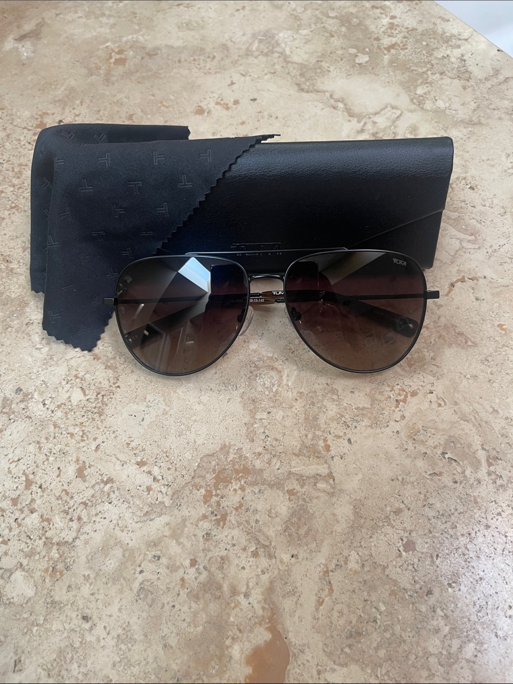 Tumi Black Frame Sunglasses with Brown Gradient Lenses